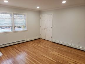 West Caldwell apartment for rent - a living room with wood floors and a door and a window
