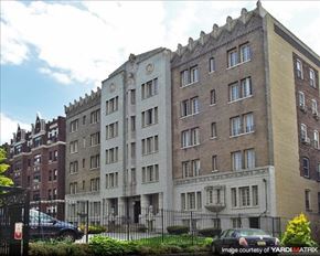 Jersey City apartment for rent - a large building with cars parked in front of it