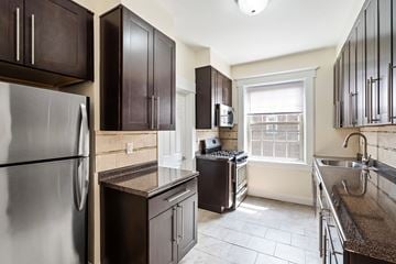 Bloomfield apartment for rent - a kitchen with stainless steel appliances and granite counter tops