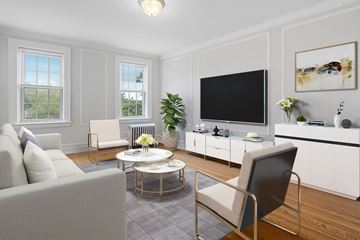 Bloomfield apartment for rent - a living room with white furniture and a tv on the wall