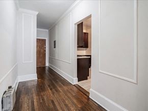 Kearny apartment for rent - a hallway with white walls and wood flooring and a doorway to a kitchen