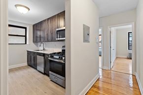 Kearny apartment for rent - an empty kitchen with a stove and a microwave