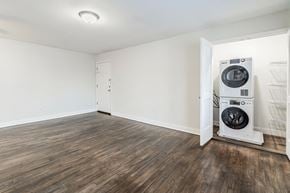Matawan apartment for rent - an empty living room with a washer and dryer in it