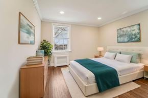 Montclair apartment for rent - A bedroom with a large bed and a window.