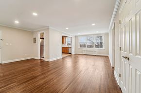 Montclair apartment for rent - A spacious room with wooden floors and white walls.