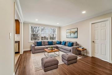 Montclair apartment for rent - A living room with a grey couch and a painting on the wall.