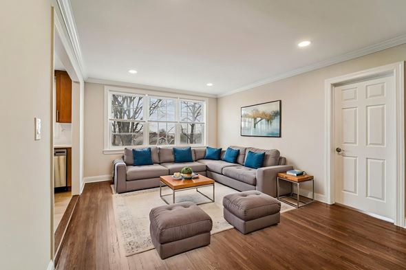 Montclair apartment for rent - A living room with a grey couch and a painting on the wall.