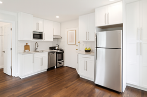 Montclair apartment for rent - A kitchen with white cabinets and a stainless steel refrigerator.