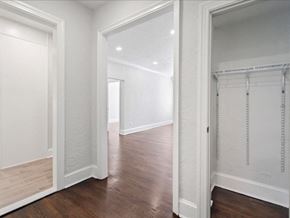 Short Hills apartment for rent - a bedroom and hallway with white walls and white closet doors