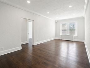 Short Hills apartment for rent - an empty living room with white walls and wood floors