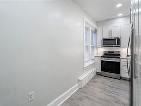 Short Hills apartment for rent - a white kitchen with a stove and a microwave