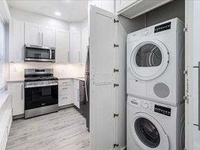 Short Hills apartment for rent - a white laundry room with a washer and a dryer