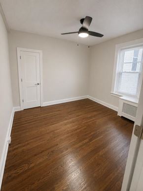 Short Hills apartment for rent - A room with a ceiling fan and a window with blinds.