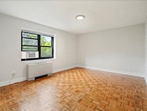 Hackensack apartment for rent - an empty room with a window and wooden floors