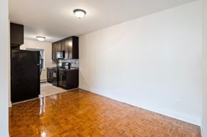 Hackensack apartment for rent - an empty living room and kitchen with a wood floor