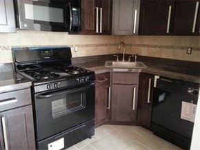 Wayne apartment for rent - a kitchen with a stove and a sink and a microwave