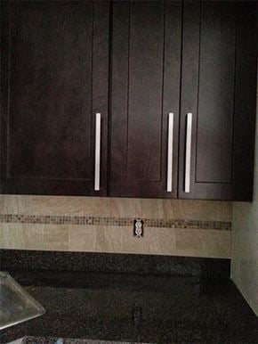 Wayne apartment for rent - a kitchen with brown cabinets and a sink