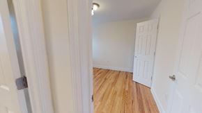 Belleville apartment for rent - a bedroom with a white door and a wood floor