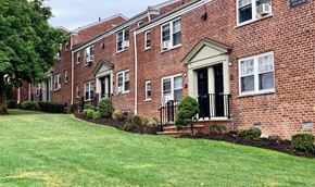Belleville apartment for rent - a brick house with a lawn in front of it