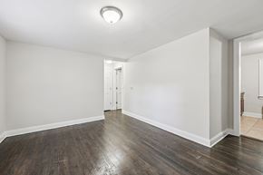 West Orange apartment for rent - A room with a wooden floor and white walls.