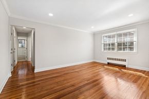 Orange apartment for rent - a living room with a hard wood floor and a window