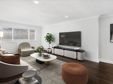 Caldwell apartment for rent - A living room with a brown chair and a white sofa.