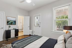 Cranford apartment for rent - A bedroom with a bed, dresser, and window.