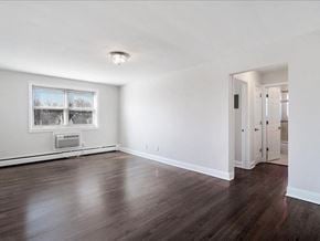 Bloomfield apartment for rent - A room with a window and a door.