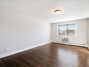 Bloomfield apartment for rent - A room with a window and a radiator on the wall.