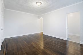 Hasbrouck Heights apartment for rent - an empty living room with white walls and wood flooring