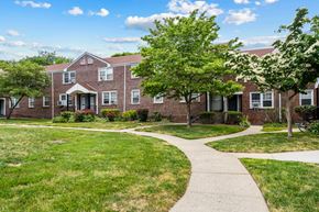 Long Branch apartment for rent - an apartment building with a sidewalk in front of it