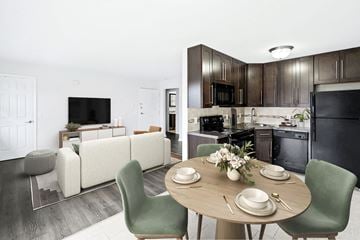Lafayette apartment for rent - A modern kitchen with a dining table set for four.