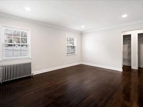 Little Falls apartment for rent - A room with wooden floors and white walls.
