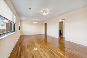 Iselin apartment for rent - an empty living room with wood floors and a large window