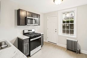 Kearny apartment for rent - a kitchen with stainless steel appliances and a window