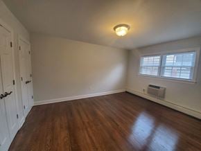 Madison apartment for rent - an empty living room with wood floors and a window