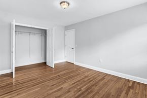 Verona apartment for rent - a bedroom with a closet and hardwood floors