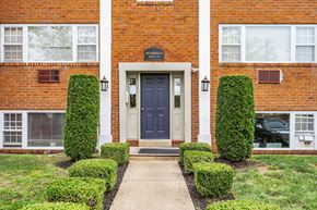 Woodbury apartment for rent - the front of a brick building with a blue door