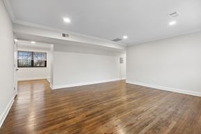 Metuchen apartment for rent - an empty living room with wood floors and white walls