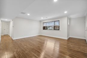 Metuchen apartment for rent - an empty living room with white walls and wood floors