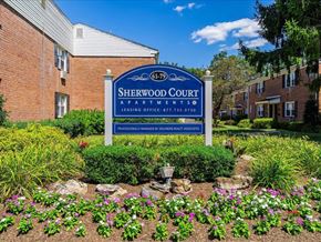 South River apartment for rent - a sign in front of a brick building