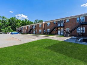 South River apartment for rent - our apartments have a spacious parking lot and green grass