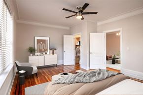 Summit apartment for rent - a bedroom with a bed and a ceiling fan