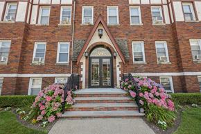 Belleville apartment for rent - A red brick building with a black door and windows.