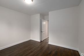 Moorestown apartment for rent - a bedroom with white walls and wood flooring and a closet