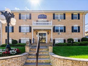 Caldwell apartment for rent - a large brick building with the sun shining in front of it