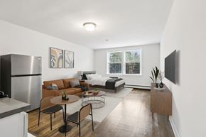 South Orange apartment for rent - A modern kitchen with a dining table and chairs.