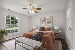 Frenchtown apartment for rent - a bedroom with a large bed and a ceiling fan