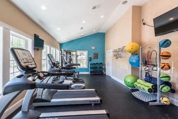 24-Hour fitness center with cardio and strength training equipment