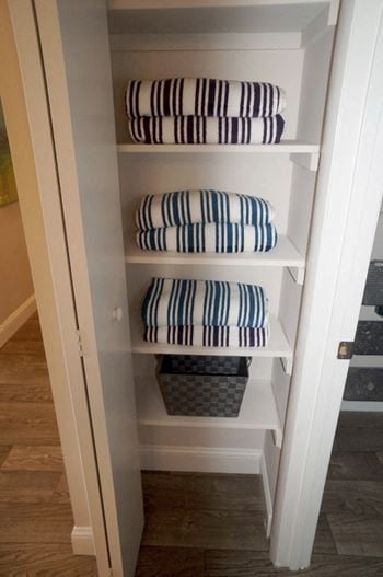 Linen closets with built-in shelving